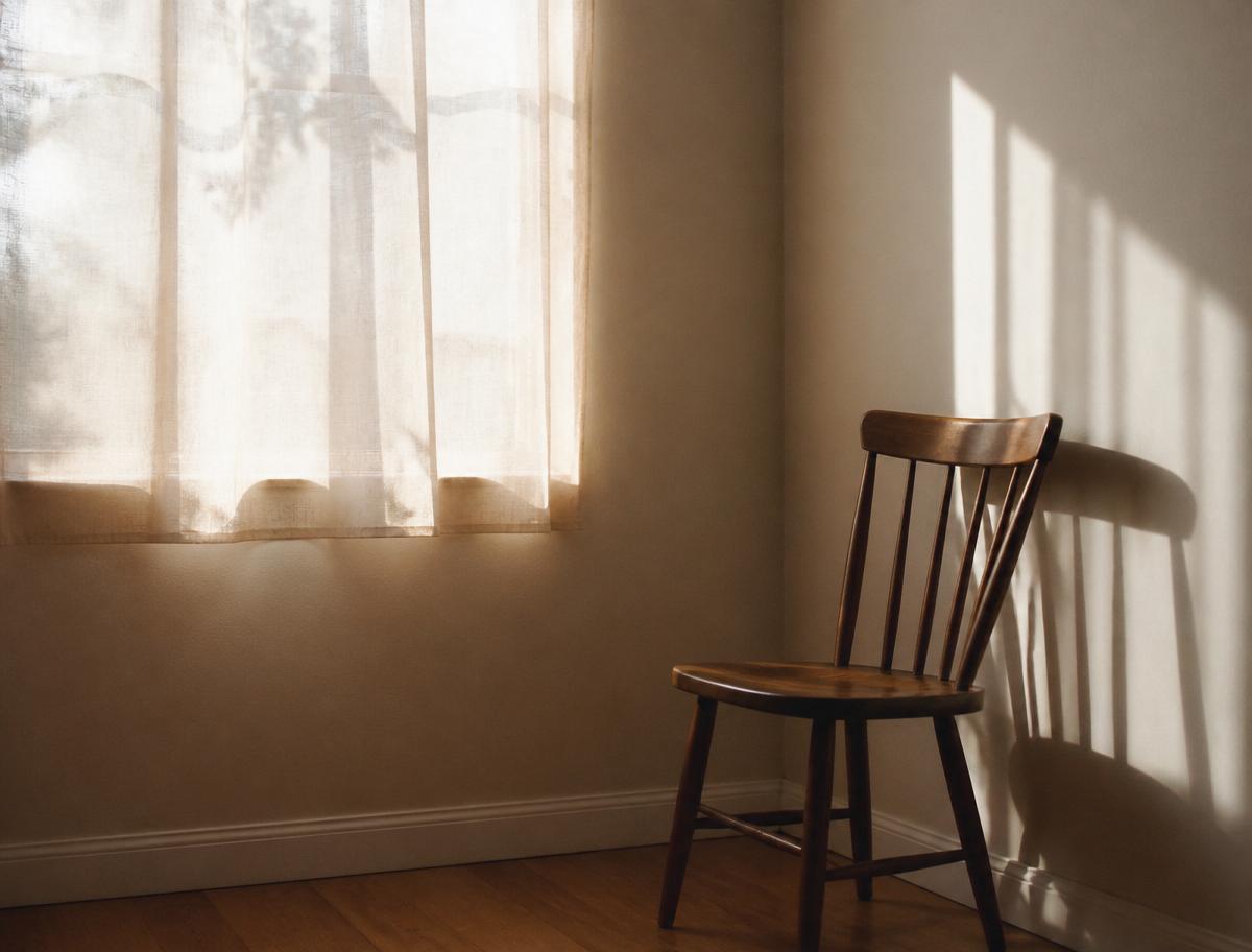 Soft daylight falling across a quiet, simply furnished room